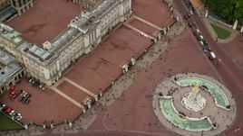 5.5K aerial stock footage of a bird's eye of Buckingham Palace and tourists, London, England Aerial Stock Footage | AX114_172
