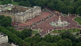 5.5K aerial stock footage of flying by Buckingham Palace and Victoria Memorial, London, England Aerial Stock Footage | AX114_191