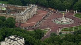 5.5K aerial stock footage of passing by Buckingham Palace and Victoria Memorial, London, England Aerial Stock Footage | AX114_192