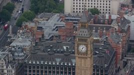 5.5K aerial stock footage of famous Big Ben and the British Flag, London, England Aerial Stock Footage | AX114_220E