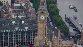 5.5K aerial stock footage flyby Big Ben and the British flag, London, England Aerial Stock Footage | AX114_225