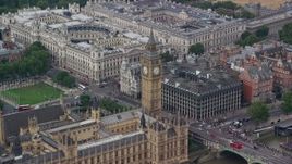 5.5K aerial stock footage orbit Big Ben, Bridge Street and Portcullis House, London, England Aerial Stock Footage | AX114_228E
