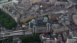 5.5K aerial stock footage of Charing Cross Railway Station and Hungerford Bridge, London, England Aerial Stock Footage | AX114_231E