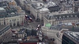 5.5K aerial stock footage of an orbit of Piccadilly Circus and double decker buses, London, England Aerial Stock Footage | AX114_234E