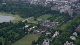 5.5K aerial stock footage of orbiting Kensington Palace and Round Pond, London, England Aerial Stock Footage | AX114_254E