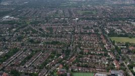 5.5K aerial stock footage of residential neighborhoods near Brent Valley Golf Club, London, England Aerial Stock Footage | AX114_278E