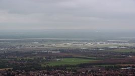 5.5K aerial stock footage of flying by London Heathrow Airport, England Aerial Stock Footage | AX114_284E