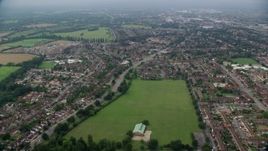 5.5K aerial stock footage of residential neighborhoods by Upton Court Park, Slough, England Aerial Stock Footage | AX114_299E