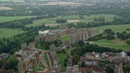 5.5K aerial stock footage of passing by Windsor Castle and St George's Chapel, England Aerial Stock Footage | AX114_314