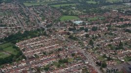 5.5K aerial stock footage of orbiting a residential neighborhood and fly away, Slough, England Aerial Stock Footage | AX114_320E