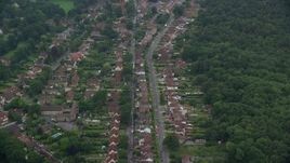 5.5K aerial stock footage of residential neighborhoods among trees, Ascot, England Aerial Stock Footage | AX114_339