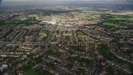 5.5K aerial stock footage of flying over suburban neighborhoods, New Malden, England Aerial Stock Footage | AX115_037E