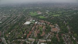 5.5K aerial stock footage of approaching Kingsdale School in rain, London, England Aerial Stock Footage | AX115_053