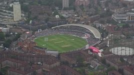 5.5K aerial stock footage of The Oval cricket stadium in the rain, London, England Aerial Stock Footage | AX115_058E