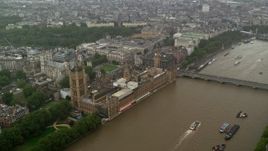 5.5K aerial stock footage approach Big Ben and Parliament from the river in the rain, London, England Aerial Stock Footage | AX115_073