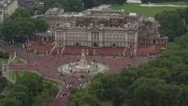 5.5K aerial stock footage of Buckingham Palace and Victoria Memorial in the rain, London, England Aerial Stock Footage | AX115_075E
