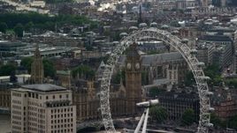 5.5K aerial stock footage of Big Ben seen through the London Eye, England Aerial Stock Footage | AX115_113