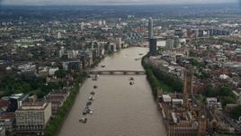 5.5K aerial stock footage of flying over bridges spanning the River Thames through London, England Aerial Stock Footage | AX115_122E