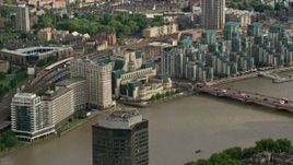 5.5K aerial stock footage of MI6 Building across the River Thames, London, England Aerial Stock Footage | AX115_139