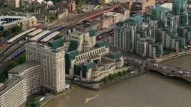 5.5K aerial stock footage fly toward the MI6 Building by River Thames, London, England Aerial Stock Footage | AX115_141