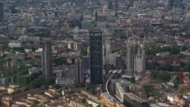 5.5K aerial stock footage of Strata Skyscraper among city buildings, London, England Aerial Stock Footage | AX115_148