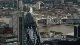 5.5K aerial stock footage flyby The Gherkin to reveal Tower Bridge, Central London, England Aerial Stock Footage | AX115_162