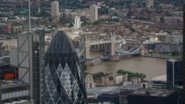 5.5K aerial stock footage flyby The Gherkin to reveal Tower Bridge, Central London, England Aerial Stock Footage | AX115_162E