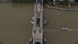 5.5K aerial stock footage of boats on River Thames passing under Tower Bridge, London, England Aerial Stock Footage | AX115_173E
