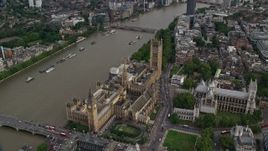 5.5K aerial stock footage orbiting Big Ben, Parliament and Westminster Abbey by the Thames in London, England Aerial Stock Footage | AX115_199