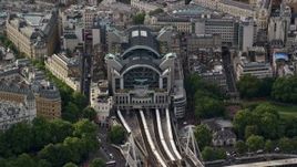 5.5K aerial stock footage of London Charing Cross Railway Station, England Aerial Stock Footage | AX115_203E