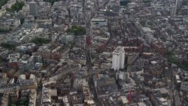5.5K aerial stock footage of city buildings surrounding Long Acre Charing Cross Road, London, England Aerial Stock Footage | AX115_207E