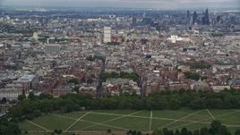 5.5K aerial stock footage of a view of the London cityscape from Hyde Park, England Aerial Stock Footage | AX115_227
