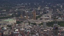 5.5K aerial stock footage of Big Ben and Parliament among city buildings, London, England Aerial Stock Footage | AX115_239E