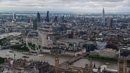 5.5K aerial stock footage of a wide view of Central London, The Shard, London Eye and Thames, England Aerial Stock Footage | AX115_253E