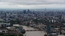 5.5K aerial stock footage of Central London skyscrapers seen from near MI6 Building, England Aerial Stock Footage | AX115_272