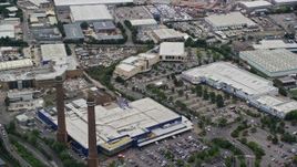 5.5K aerial stock footage of smoke stacks at the Valley Park Retail Area, Croydon, England Aerial Stock Footage | AX115_287E