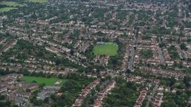 5.5K aerial stock footage of a residential neighborhood, Wallington, England Aerial Stock Footage | AX115_293E