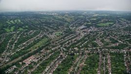 5.5K aerial stock footage of flying over suburban homes near railroad tracks, Purley, England Aerial Stock Footage | AX115_297E