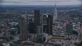 5.5K aerial stock footage orbit and approach skyscrapers, The Shard near River Thames, London, England, twilight Aerial Stock Footage | AX116_015E
