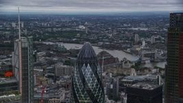 5.5K aerial stock footage flyby Heron Tower, reveal The Gherkin skyscraper, London, England, twilight Aerial Stock Footage | AX116_018E