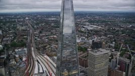 5.5K aerial stock footage of flying by The Shard skyscraper in London, England, twilight Aerial Stock Footage | AX116_021E