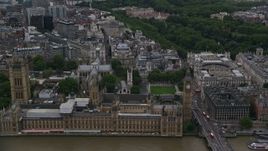 5.5K aerial stock footage approach British Parliament, Big Ben, and Westminster Abbey, London, England, twilight Aerial Stock Footage | AX116_024E
