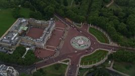 5.5K aerial stock footage of a bird's eye view of Buckingham Palace and Victoria Memorial, London, England, twilight Aerial Stock Footage | AX116_030
