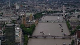 5.5K aerial stock footage of Parliament, and bridges spanning the River Thames, London, England, twilight Aerial Stock Footage | AX116_071