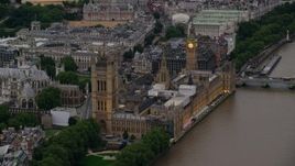 5.5K aerial stock footage of approaching Big Ben and British Parliament from River Thames, London, England, twilight Aerial Stock Footage | AX116_073