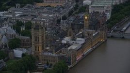 5.5K aerial stock footage of approaching Big Ben and British Parliament from River Thames, London, England, twilight Aerial Stock Footage | AX116_073E