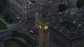 5.5K aerial stock footage of flying by famous Big Ben in London, England, twilight Aerial Stock Footage | AX116_076E