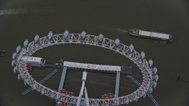 5.5K aerial stock footage of orbiting the London Eye on the River Thames, London, England, twilight Aerial Stock Footage | AX116_078