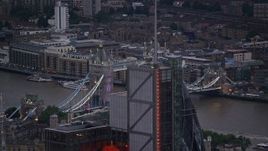 5.5K aerial stock footage flyby 122 Leadenhall Street to reveal Tower Bridge and River Thames, London, England, twilight Aerial Stock Footage | AX116_088E