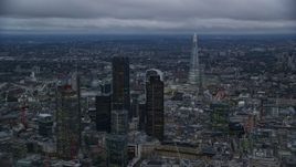 5.5K aerial stock footage flyby skyscrapers and cityscape, The Shard in background, London, England, twilight Aerial Stock Footage | AX116_091E